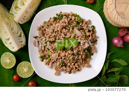 Local Thai food, Spicy minced pork salad (Larb Moo), Table top view Local Thai food, Spicy minced pork salad (Larb Moo), Table top view 103077270