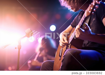 Melodic Echoes: Guitarist Enchants the Stage with Soft and Blur Background. created with Generative AI Melodic Echoes: Guitarist Enchants the Stage with Soft and Blur Background. created with Generative AI 103083692