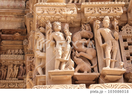 Decorative wall carving ornament with figurine of mythical character, demon, elephant, griffin. Western Temples in Khajuraho (Temples of love), India. Unesco World Heritage Site Decorative wall carving ornament with figurine of mythical character, demon, elephant, griffin. Western Temples in Khajuraho (Temples of love), India. Unesco World Heritage Site 103086018