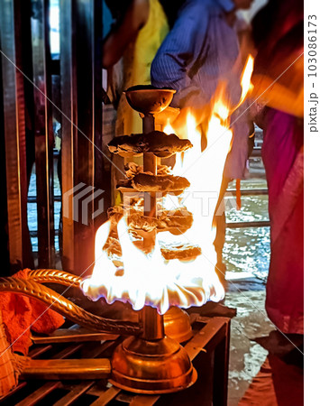 Closeup of big diya lit during Aarti in Haridwar 103086173