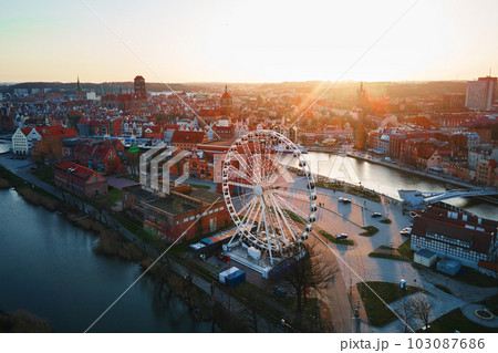 Aerial view of ferris wheel attraction in Gdansk city, Poland. Panoramic view of touristic place in european city Aerial view of ferris wheel attraction in Gdansk city, Poland. Panoramic view of touristic place in european city 103087686