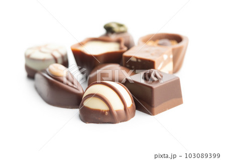 Sweet chocolate pralines. Tasty chocolate truffles isolated on white background. Sweet chocolate pralines. Tasty chocolate truffles isolated on white background. 103089399