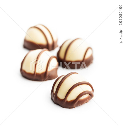 Sweet chocolate pralines.  Tasty chocolate truffles isolated on white background. 103089400