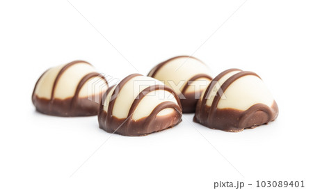 Sweet chocolate pralines.  Tasty chocolate truffles isolated on white background. 103089401