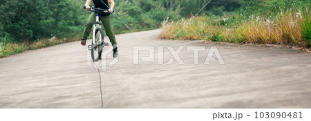 Riding bike in spring forest 103090481