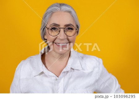 Positive and determined senior woman in light shirt Positive and determined senior woman in light shirt 103096295