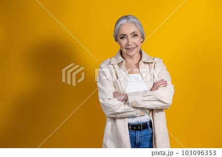 Waist up picture of a good-looking senior woman 103096353
