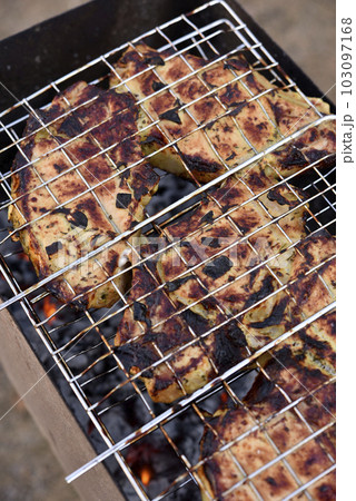 Pork meat in an iron mesh. Barbecue meat. Roast pork. Pork loin. Pork meat in an iron mesh. Barbecue meat. Roast pork. Pork loin. 103097168