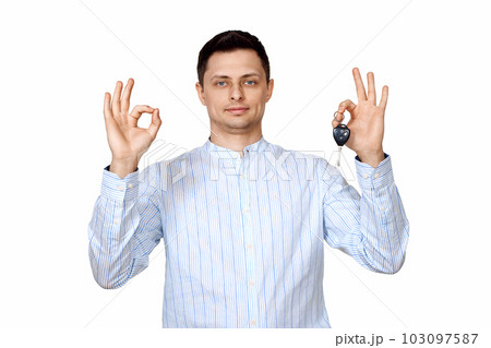 man holding car keys. Car dealerships offer car . man holding car keys. Car dealerships offer car . 103097587
