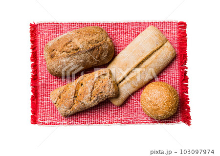 Freshly baked delicious french bread with napkin isolated on white background top view. Healthy white bread loaf 103097974