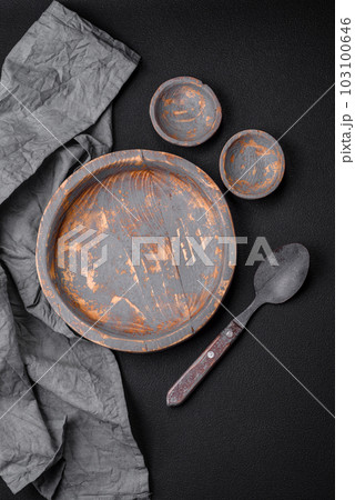 Empty wooden plate, knife, fork and cutting board 103100646