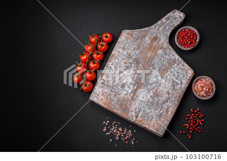 Empty wooden cutting board with cracks and scuffs 103100716