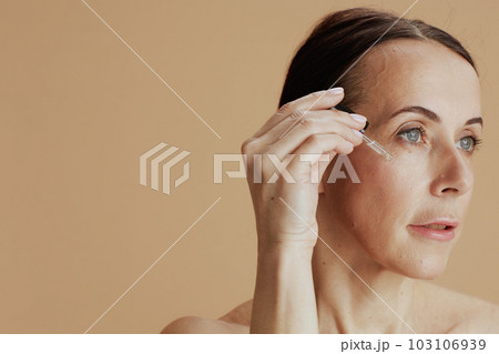modern 40 years old woman on beige background 103106939