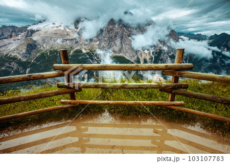 landscape with mountains, clouds and fence landscape with mountains, clouds and fence 103107783