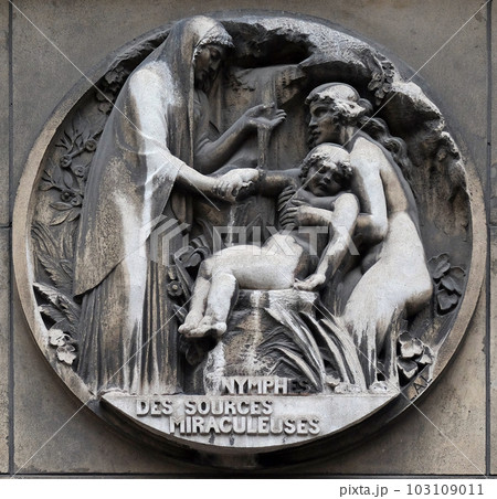 Nymphs from miraculous sources. Stone relief at the building of the Faculte de Medicine Paris, France. 103109011