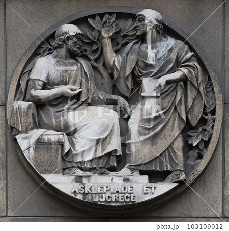 Asclepiade and Lucrece, Greek medicine in Rome. Stone relief at the building of the Faculte de Medicine Paris, France. 103109012