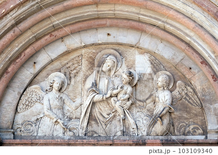 Bass-relief representing the Virgin Mary with baby Jesus between angels, Cathedral of S.Martino in Lucca, Italy 103109340