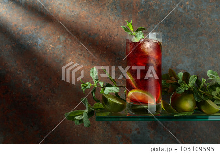 Cuba Libre with brown rum, cola, mint, and lime. 103109595