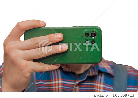 Hand of a man in shirt close-up holding a mobile phone or smartphone in a green case on a white background, isolated Hand of a man in shirt close-up holding a mobile phone or smartphone in a green case on a white background, isolated 103109713