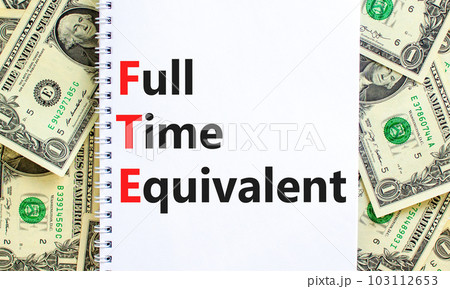 FTE Full time equivalent symbol. Concept words FTE Full time equivalent on white note. Dollar bills. Beautiful background from dollar bills. Business and FTE Full time equivalent concept. Copy space. FTE Full time equivalent symbol. Concept words FTE Full time equivalent on white note. Dollar bills. Beautiful background from dollar bills. Business and FTE Full time equivalent concept. Copy space. 103112653