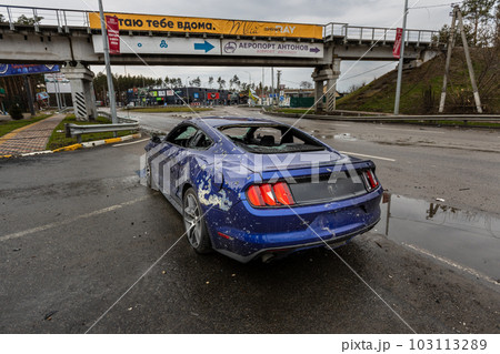Hostomel, Kyev region Ukraine - 09.04.2022: Shot cars. On the streets of Irpin. Cities of Ukraine after the Russian occupation. Irpin, Bucha, Hostomel. 103113289