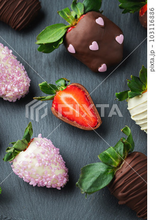 Gourmet chocolate covered strawberries on the dark background 103116886