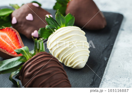 Gourmet chocolate covered strawberries on the dark background 103116887