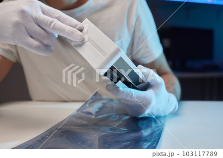 Changing the thermal paste on the graphics processor. Disassembled graphics card on the table. Old graphics card service. 103117789