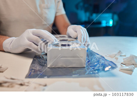 Changing the thermal paste on the graphics processor. Disassembled graphics card on the table. Old graphics card service. Changing the thermal paste on the graphics processor. Disassembled graphics card on the table. Old graphics card service. 103117830