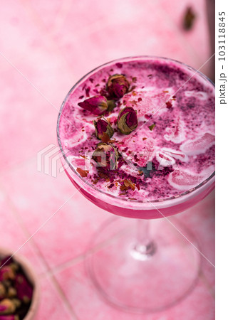 Summer pink cocktail with rose flowers 103118845