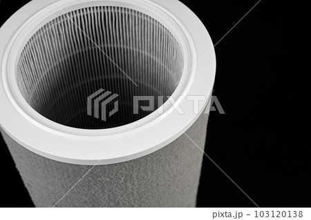 Dust contaminated home air purifier filter on dark background Dust contaminated home air purifier filter on dark background 103120138