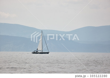 Sailing boat in the distance Sailing boat in the distance 103122280
