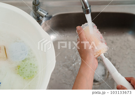 mother hand washing baby plastic milk bottle mother hand washing baby plastic milk bottle 103133673