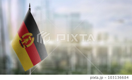 A small GDR flag on an abstract blurry background 103136684
