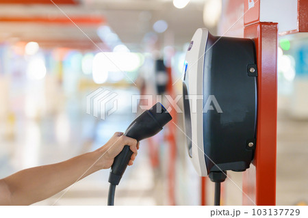 EV charger station for Electric car charging battery at station. green energy power, Eco friendly alternative, technology and environment concepts 103137729