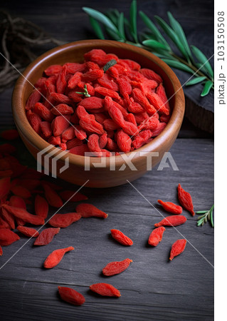 Goji berry on a wooden background Goji berry on a wooden background 103150508