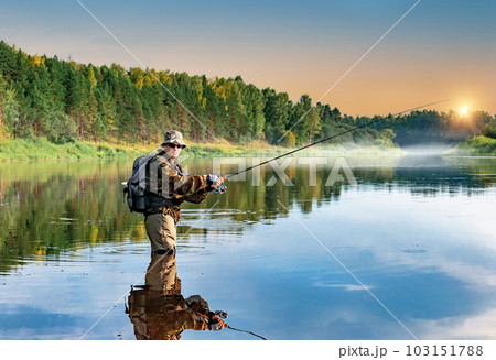 A fisherman is fishing in the Volga River. Russia, summer. 103151788
