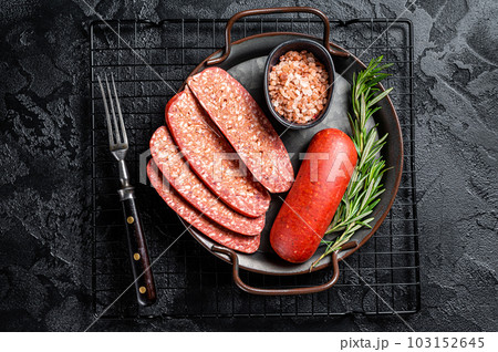 Turkish Sliced Sucuk beef meat sausage ready for cooking. Black background. Top view 103152645