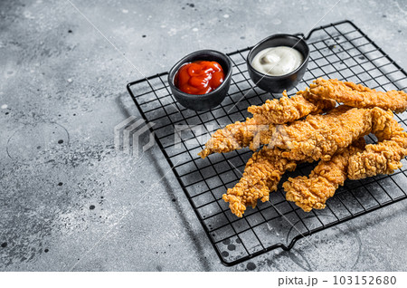 Dip fried Chicken Steak Fingers strips with sauces. Gray background. Top view. Copy space 103152680