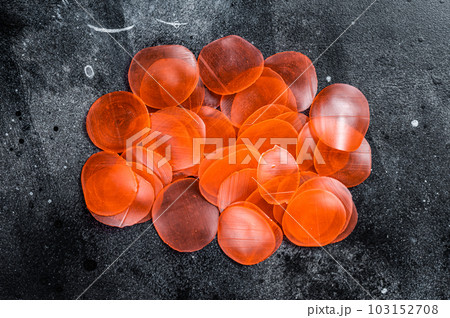 Raw kerupuk or prawn shrimp crackers, chips. Black background. Top view Raw kerupuk or prawn shrimp crackers, chips. Black background. Top view 103152708