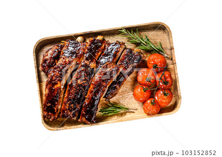 Delicious barbecued ribs seasoned with a spicy basting sauce and served with baked tomatoes. Isolated on white background. Delicious barbecued ribs seasoned with a spicy basting sauce and served with baked tomatoes. Isolated on white background. 103152852