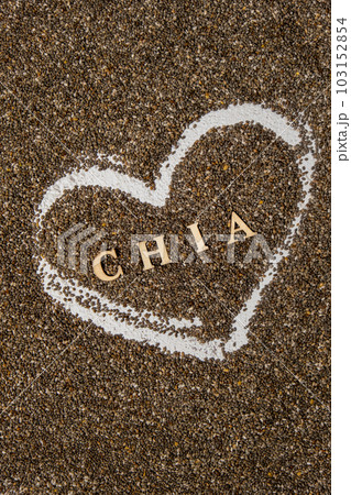 Heart made of chia seeds with word CHIA inside background. Healthy superfood rich in Omega 3 fatty acids. Dry healthy natural ingredient. Vegetarian food favorite dietary 103152854