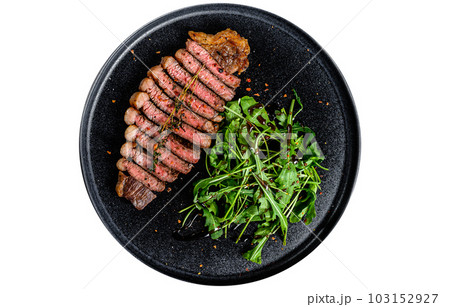 Sliced sirloin steak, marbled beef meat with arugula. Isolated on white background. Sliced sirloin steak, marbled beef meat with arugula. Isolated on white background. 103152927