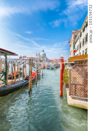 cityscape of Venice with famous Canal Grande and Basilica di Santa Maria della Salute church. 103156732
