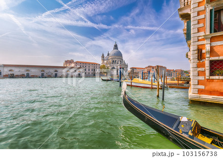cityscape of Venice with famous Canal Grande and Basilica di Santa Maria della Salute church. 103156738