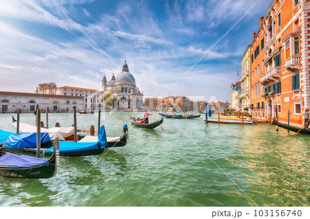 cityscape of Venice with famous Canal Grande and Basilica di Santa Maria della Salute church. 103156740