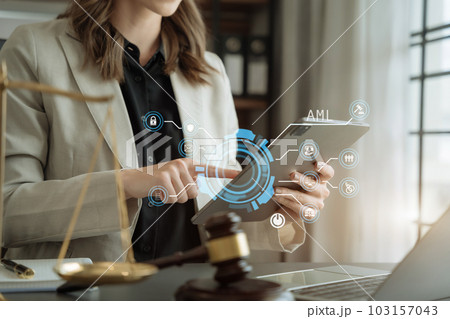 Judge in a courtroom using laptop and tablet with AML anti money laundering icon on virtual screen. 103157043