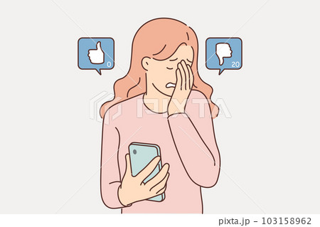 Woman blogger suffers sees dislikes under own post on social network and cries holding phone 103158962