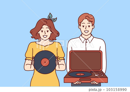 Happy couple with turntable and vinyl record invites you to retro party with jazz music.  103158990