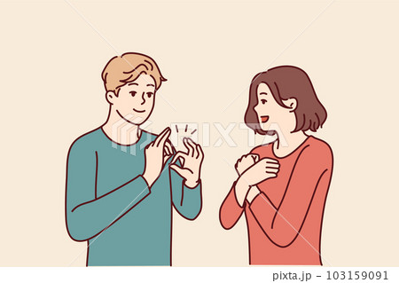 Deaf-mute man and woman are talking using sign language and demonstrating symbols with hands 103159091